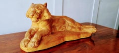 A signed large terracotta sculpture of a lioness by Richard Fath.