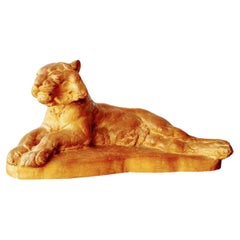 A signed large terracotta sculpture of a lioness by Richard Fath.