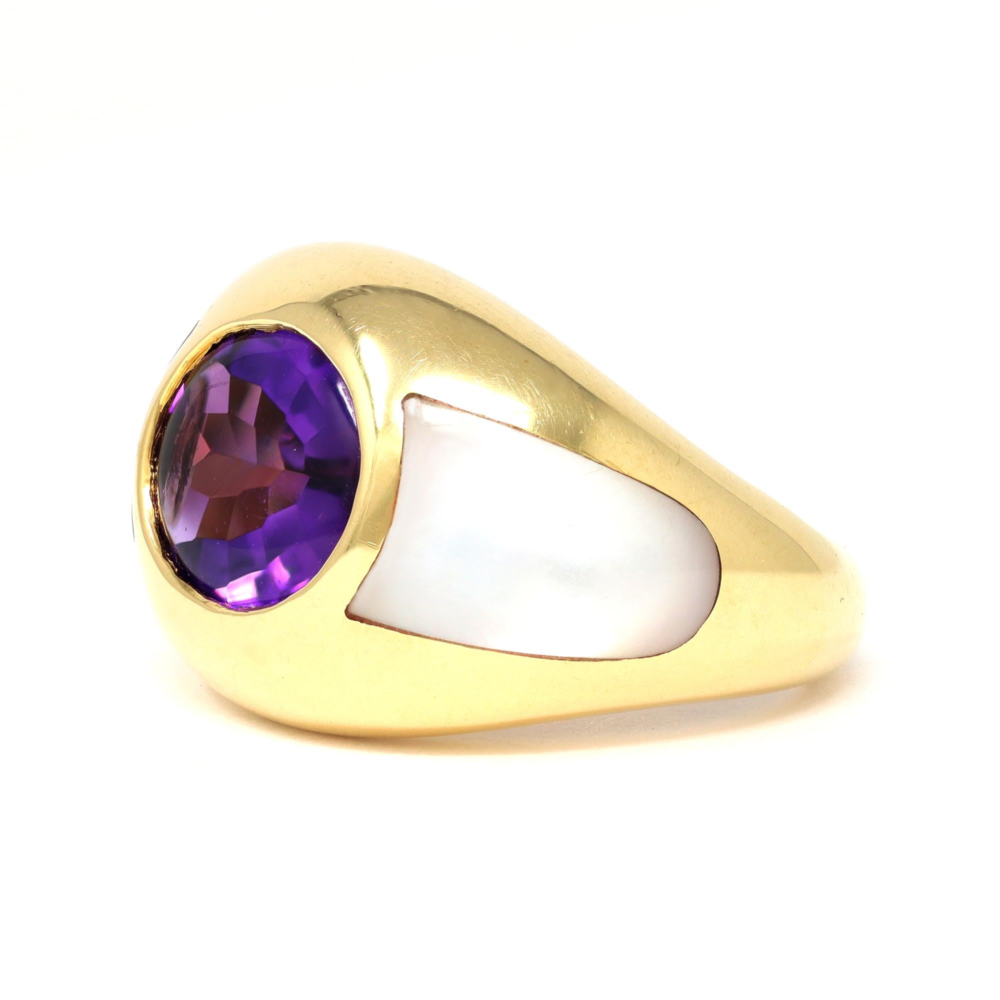 An 18 karat yellow gold, amethyst and mother-of-pearl ring by the famous French house of high end jewelry Mauboussin Paris. The bezel set Amethyst weighs approximately 2.20 carats. It is flanked by polished mother of pearl especially cut to fit each