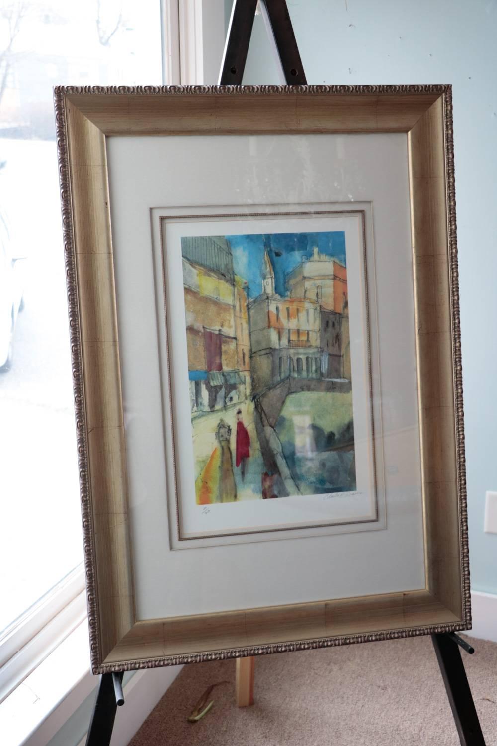 A signed pair of Charles R Davies colorful scenes Art Window Looks and Inkempen. A pencil signed limited edition giclee of a watercolor painting. One is titled Window Looks the other In Kempen. InKempen is numbered 24/450 in pencil. Window looks is