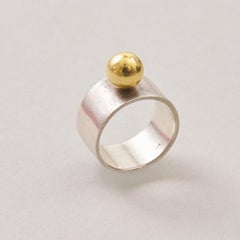 A Silver and 18k Gold Ring
