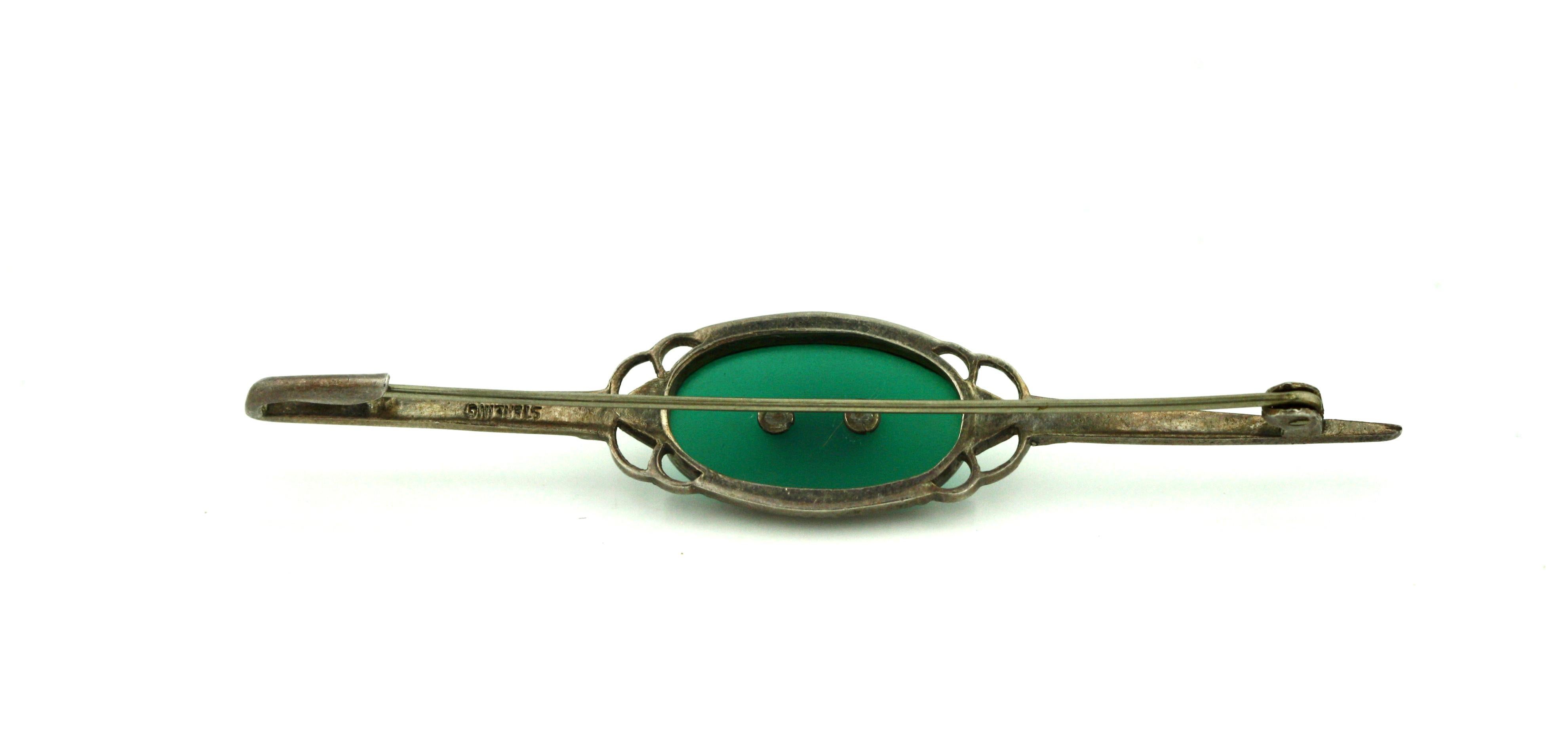 
A Silver and Colored Stone Brooch
Art Deco Style Pin / Brooch, 3 in. overall length
gross weight 5.2 grams
marked STERLING