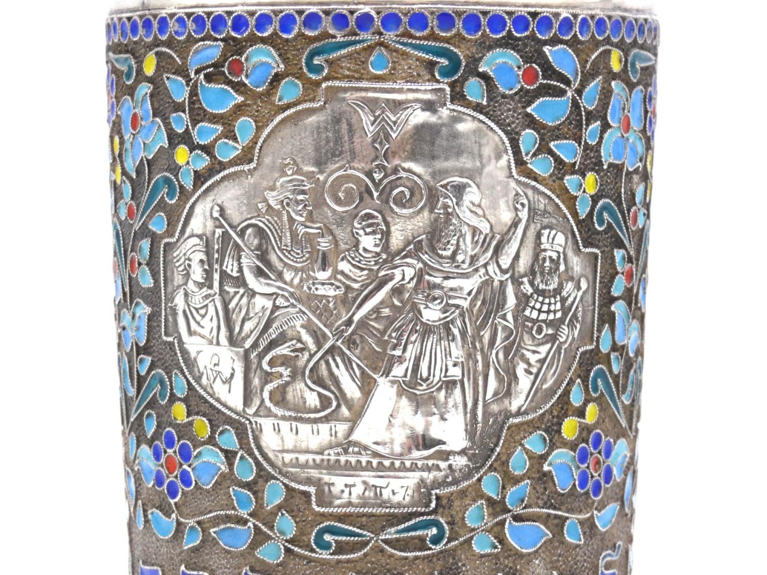 A Silver and Enamel Passover Kiddush Cup by Henryk Winograd, New York, 1995


Spectacular Kiddush cup for the Passover holiday beautifully embellished with floral and enamel motifs each encircled with fine filigree. Cartouche at front center