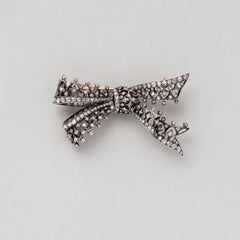 A Silver and Gold Antique Bow Brooch set with Diamonds
