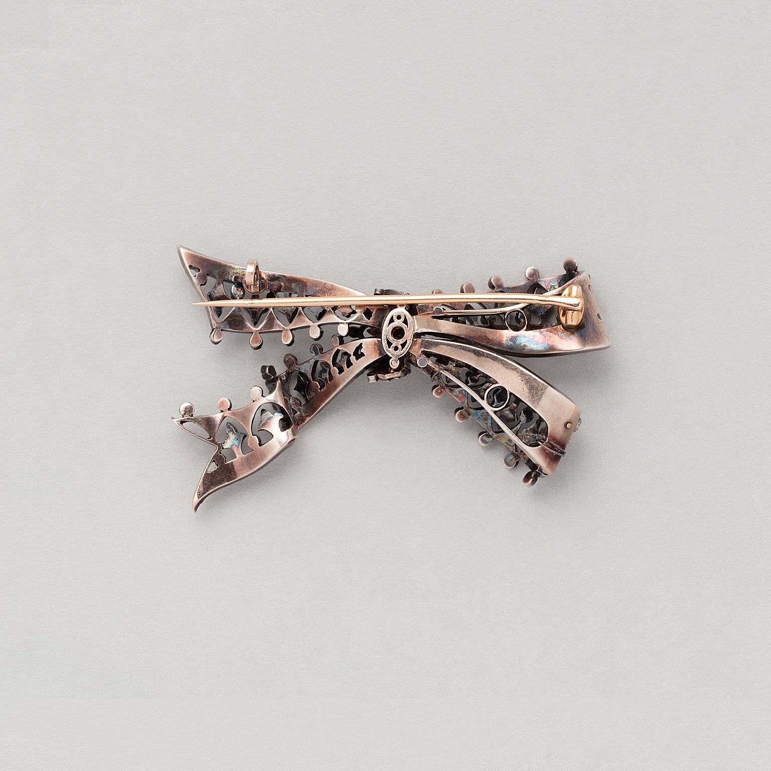Victorian A Silver and Gold Antique Bow Brooch set with Diamonds For Sale