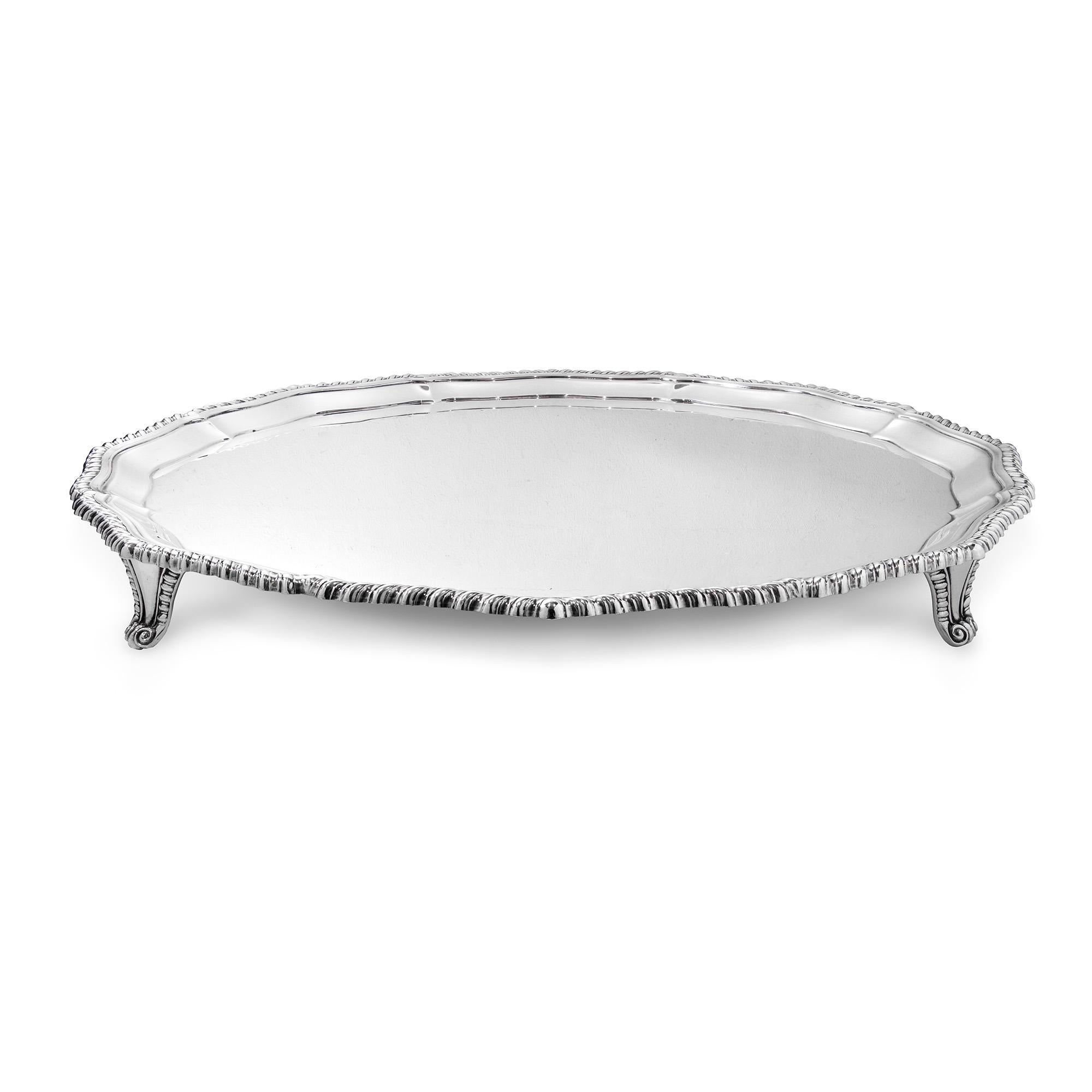 A sterling silver circular shaped salver, with applied gadroon mount, on four scroll bracket feet, 42.5cm in diameter, gross weight 67.5ozs, hallmarked Sheffield 1933, maker Stevenson & Law. 

Should you choose to make this purchase we would be