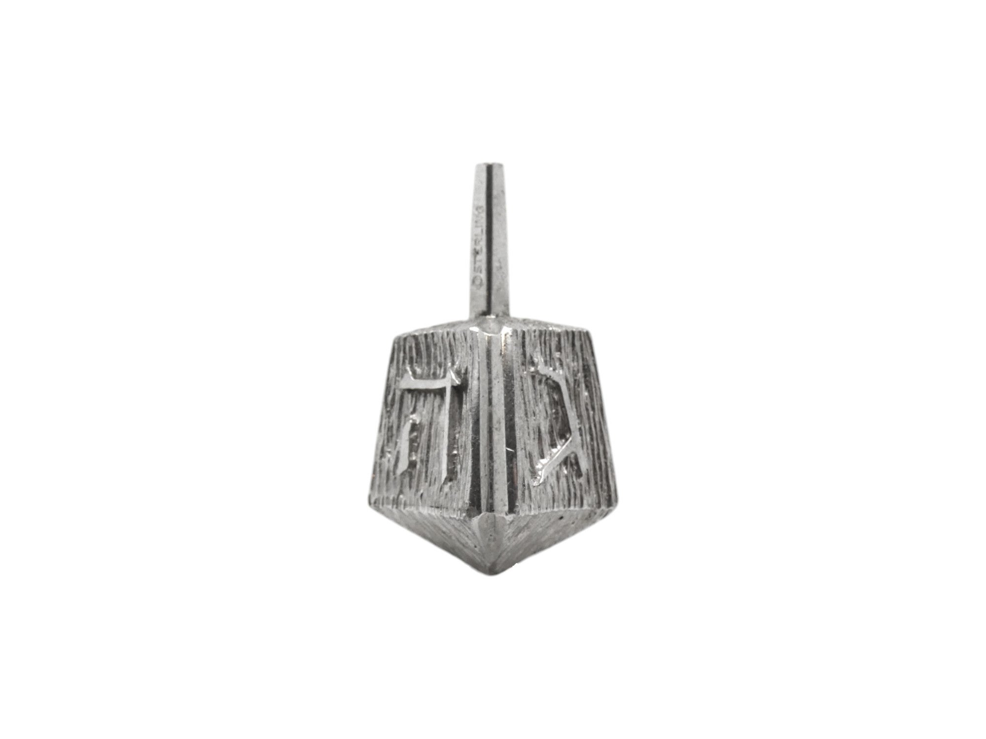 A Silver Dreidel made by Ludwig Yehuda Wolpert, Circa 1970.

Ludwig Yehuda Wolpert was an Israeli-American goldsmith and designer, born in Germany. He is celebrated as the first artist to design Judaica in modern styles. His works were greatly