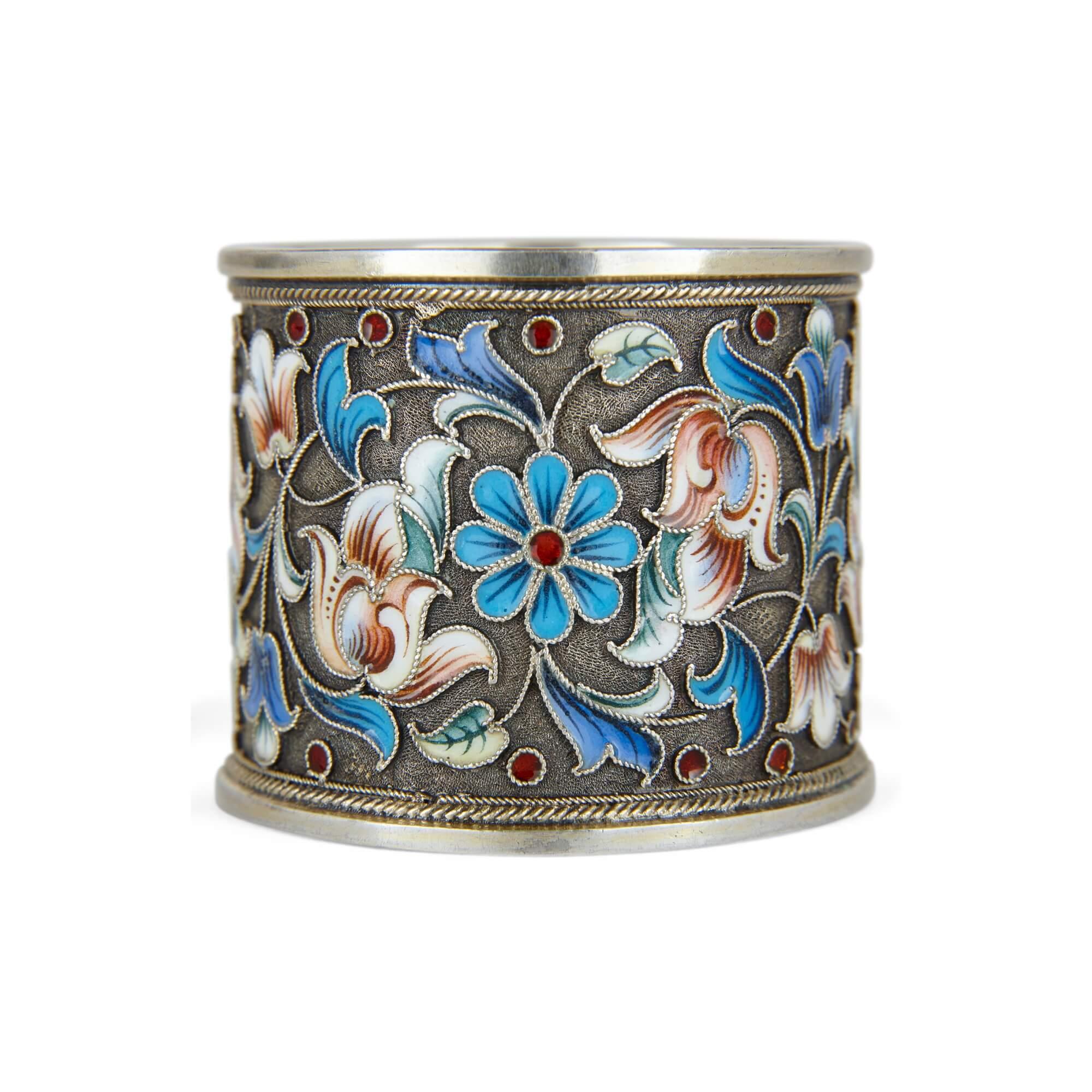 A silver-gilt and cloisonné-enamel Russian napkin ring 
Moscow, early 20th century
Measures: Height 4cm, diameter 5cm

This delightful item is a Russian napkin ring, crafted from silver-gilt and cloisonné-enamel, a typical combination, and was