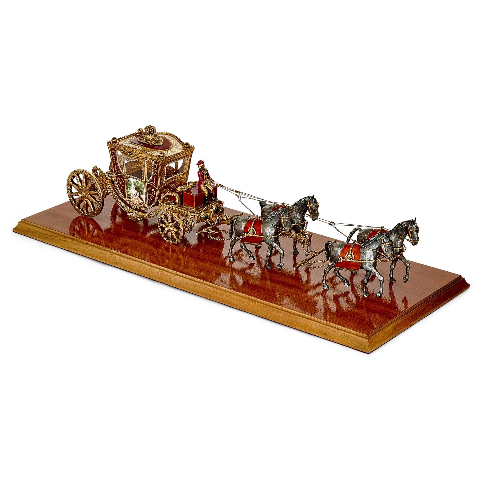 A silver-gilt and enamel Austro-Hungarian horse drawn carriage model
Austro-Hungarian, Early 20th Century
Case: 28cm high x 89cm wide x 44cm depth.
Horse & carriage: 20cm high x 73.5cm wide x 29cm depth. 

This superb objet d'art is a