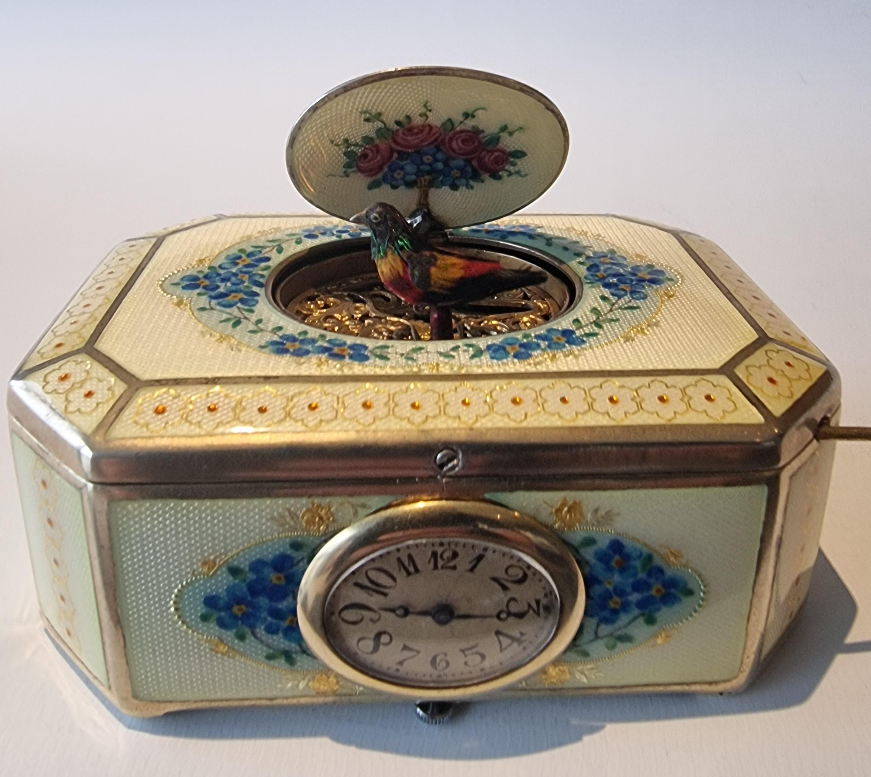 A very fine silver gilt and  Imperial Yellow guilloche enamel singing bird box with timepiece, by C. A. Marguerat, with a Nightingale on the lid. The Nightingale has appeared in many thousands of poems from Homer to the twentieth century, and even