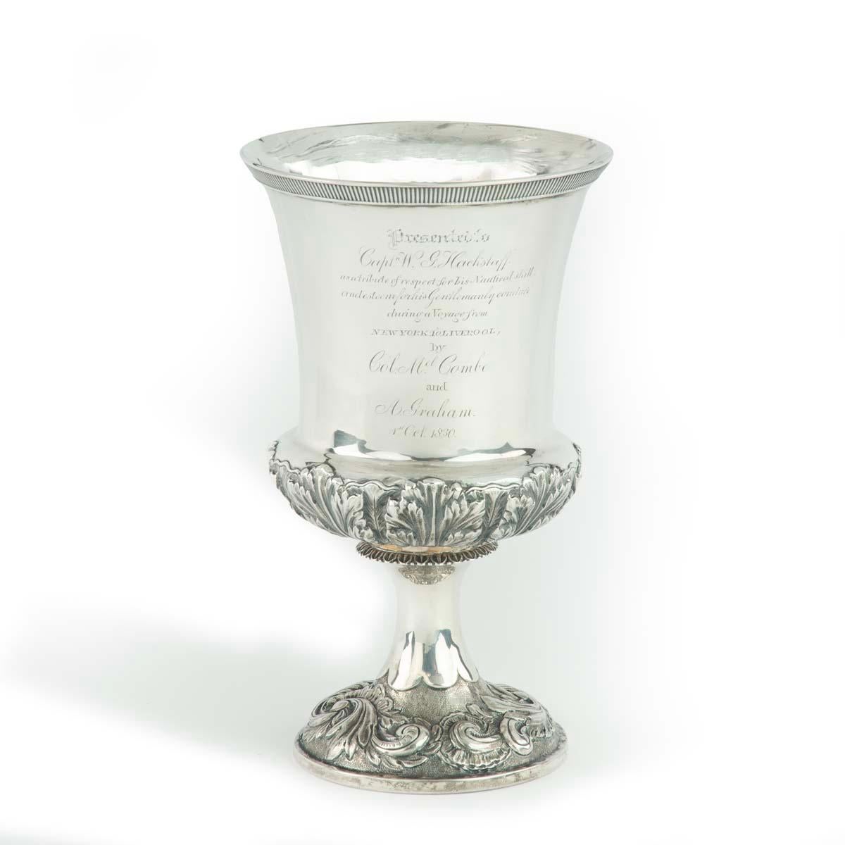 This flared silver cup has a border of repoussé scrolls and foliage on the lower bulb of the goblet and around the foot.  The full inscription is written below.  Partially assayed for maker John Edward Terrey and retailers Wordley & Co, Liverpool,