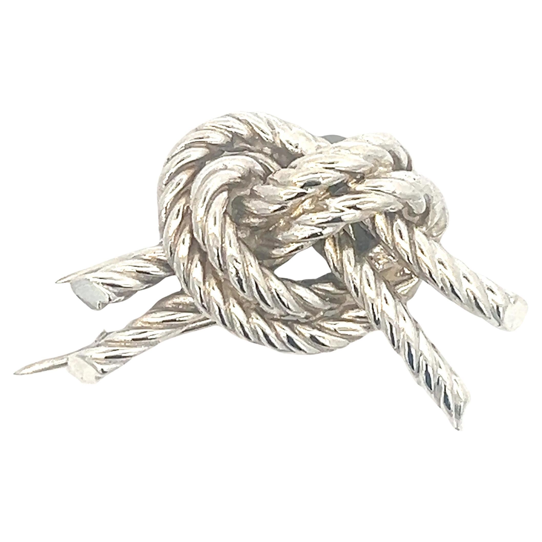 A silver knot brooch by Hermès For Sale