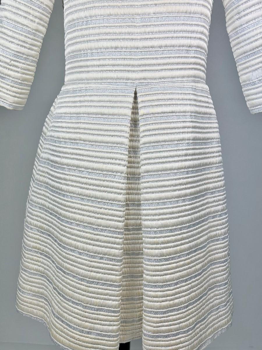A silver lamé satin coat with jewelled buttons - France Circa 1960 For Sale 5