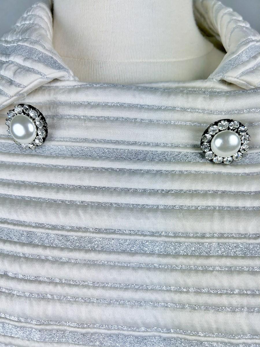 A silver lamé satin coat with jewelled buttons - France Circa 1960 For Sale 6