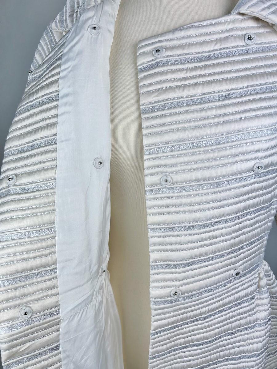 A silver lamé satin coat with jewelled buttons - France Circa 1960 For Sale 7