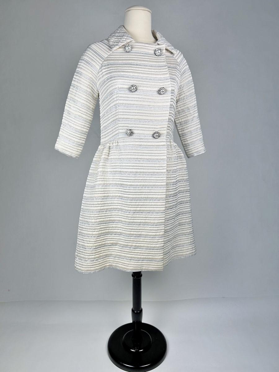 Silver A silver lamé satin coat with jewelled buttons - France Circa 1960 For Sale