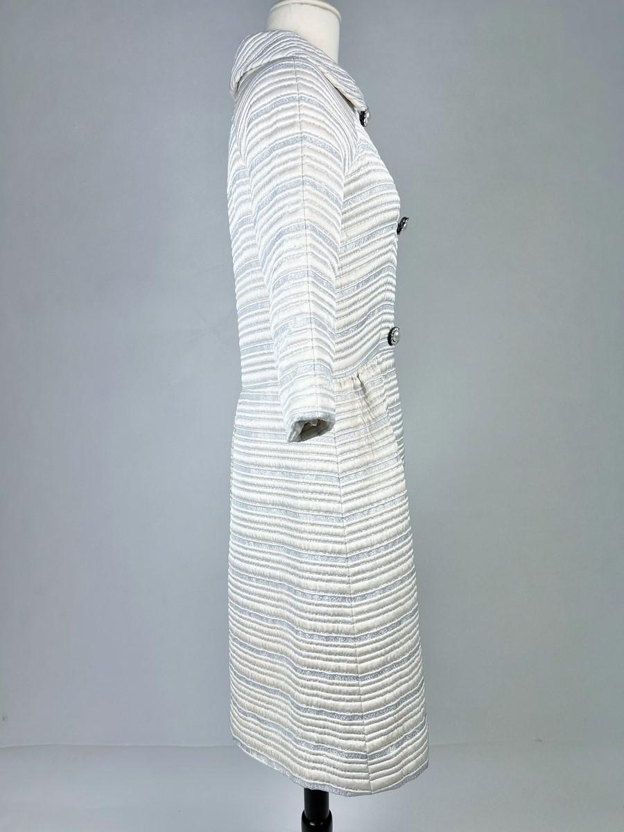 A silver lamé satin coat with jewelled buttons - France Circa 1960 For Sale 3
