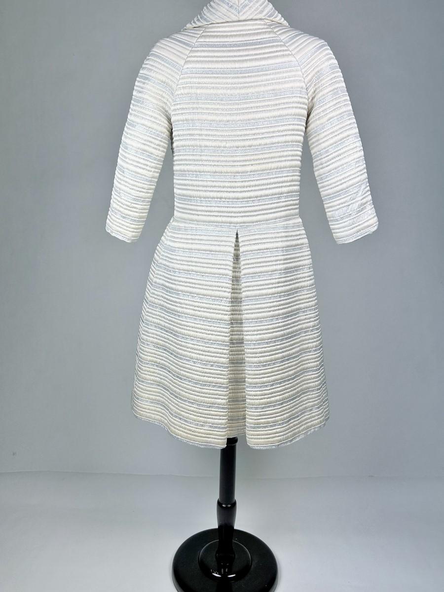 A silver lamé satin coat with jewelled buttons - France Circa 1960 For Sale 4