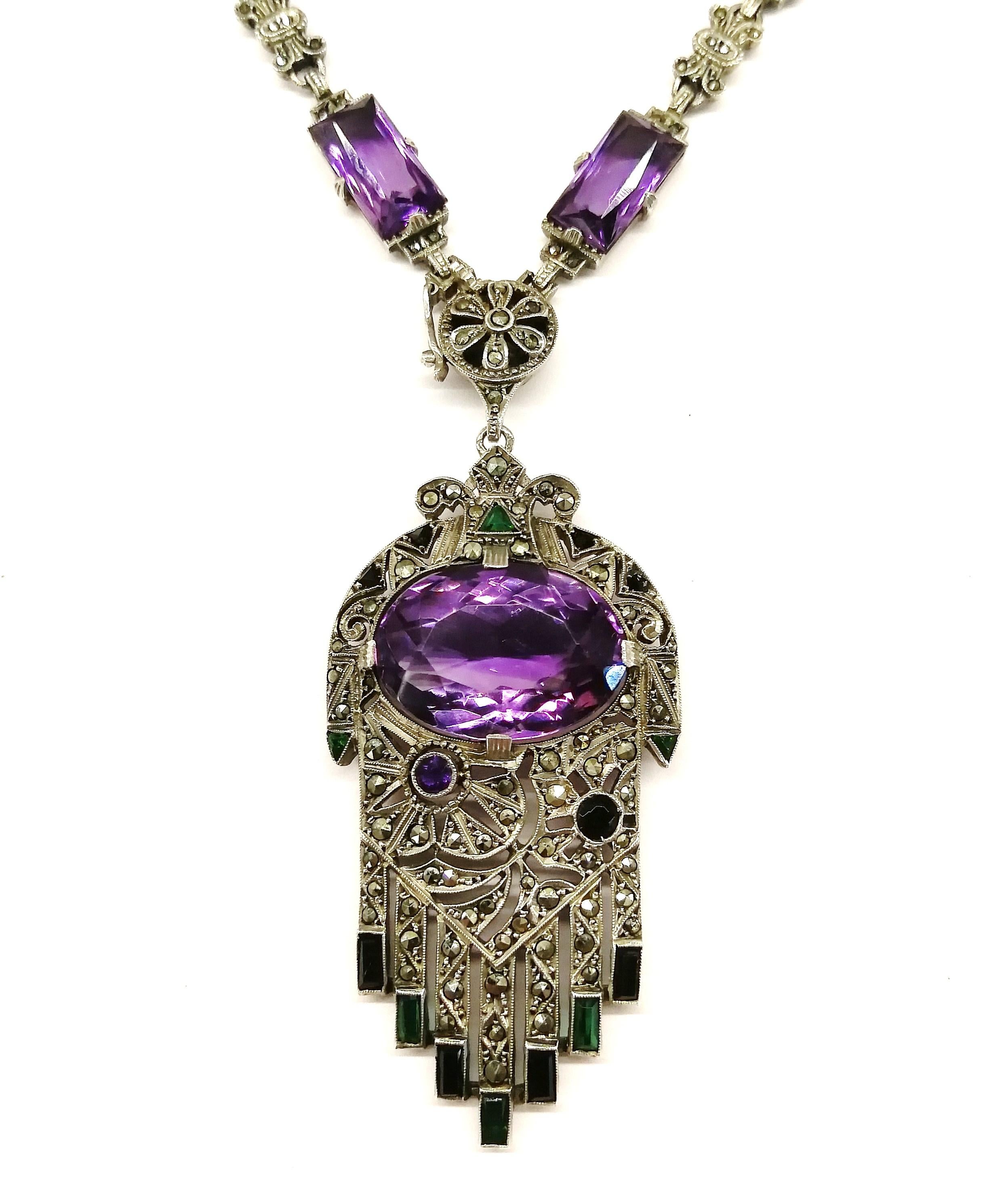 A high Deco very stylised pendant necklace, from Germany in the 1920, an excellent example of the craftsmanship and design of the period in Germany. Set with rectangular cut amethysts, a large central cushion cut amethyst in the pendant, set all