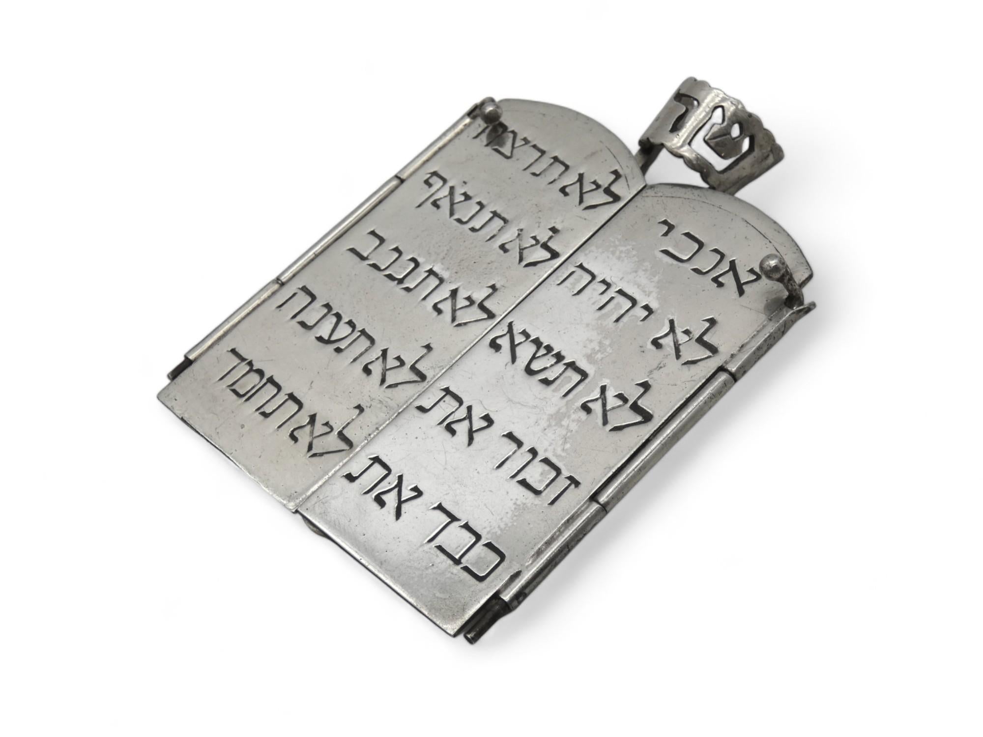 A Spiritual Silver Mezuzah Case by William B. Meyers made in Newark, New Jersey Circa 1950.

William B. Meyers is a renowned American silversmith and artist of the 20th Century. Meyer's Pieces tell a certain story or sermon rather, of the passion