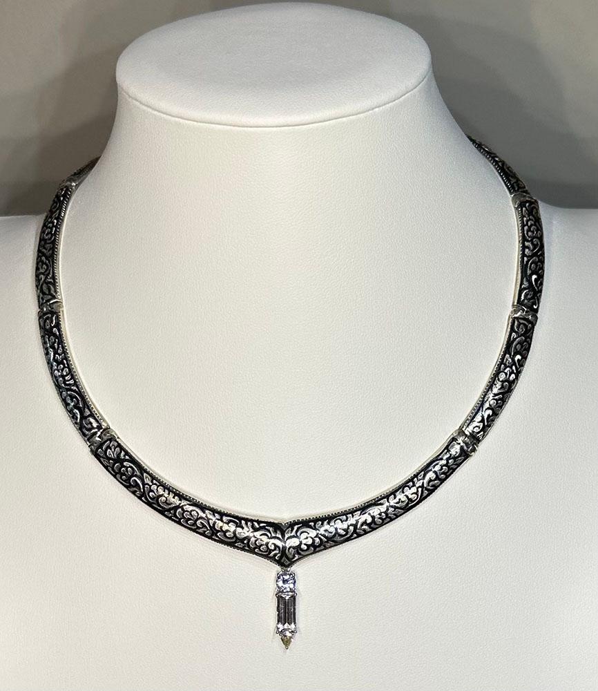 A Silver Nielloware Necklace with a removable Jeweled Pendant. This necklace is fashioned in southern Thailand using the Nielloware technique of inlaying nickel oxide into the silver creating a lovely design of silver and black contrasting together.