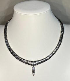 A Silver Nielloware Necklace with a removable White Gold Jeweled Pendant