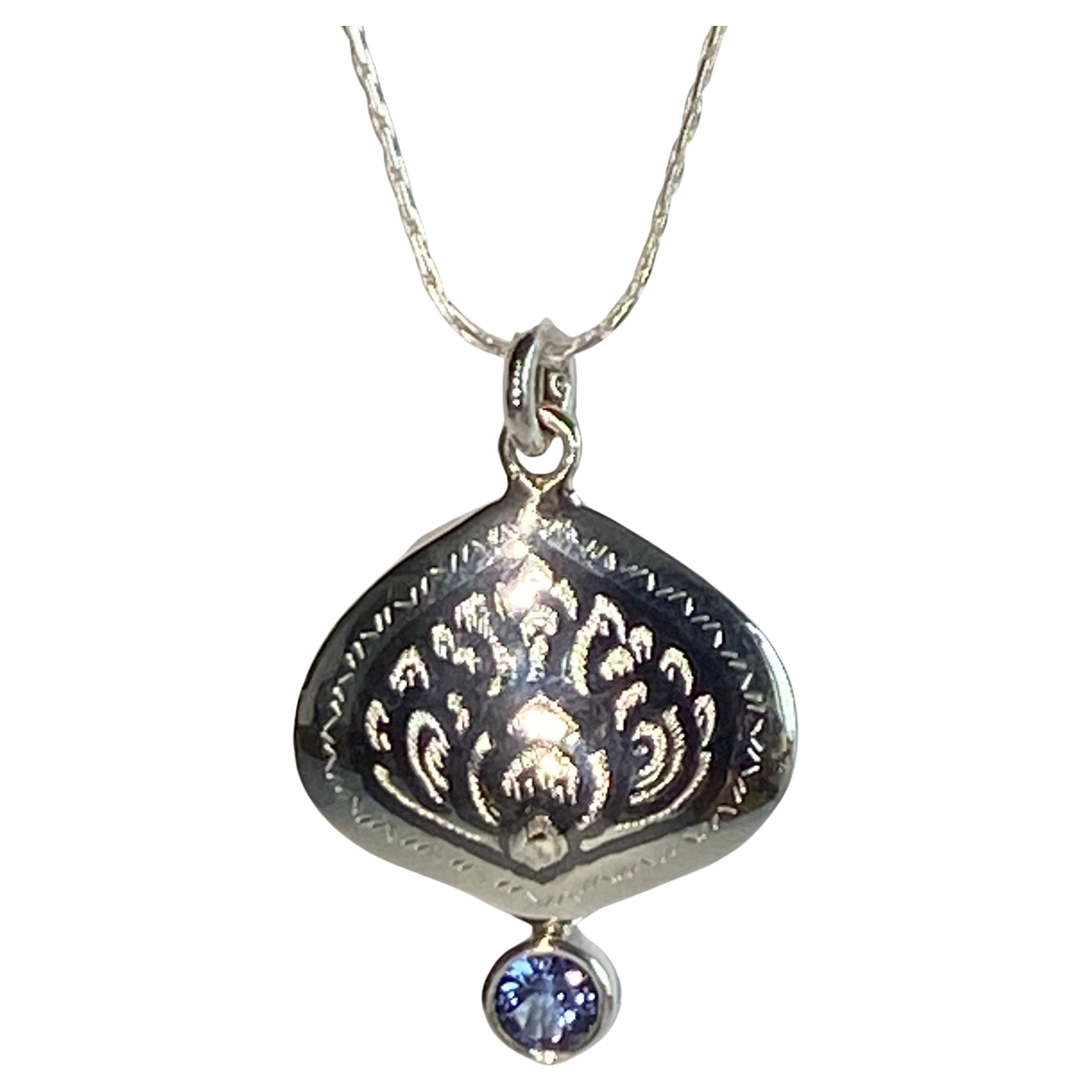 A Silver Filagree Pendant Accented with Tanzanite For Sale