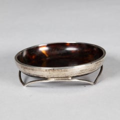 A silver pin dish with a bakelite centre with silver mark Birmingham
