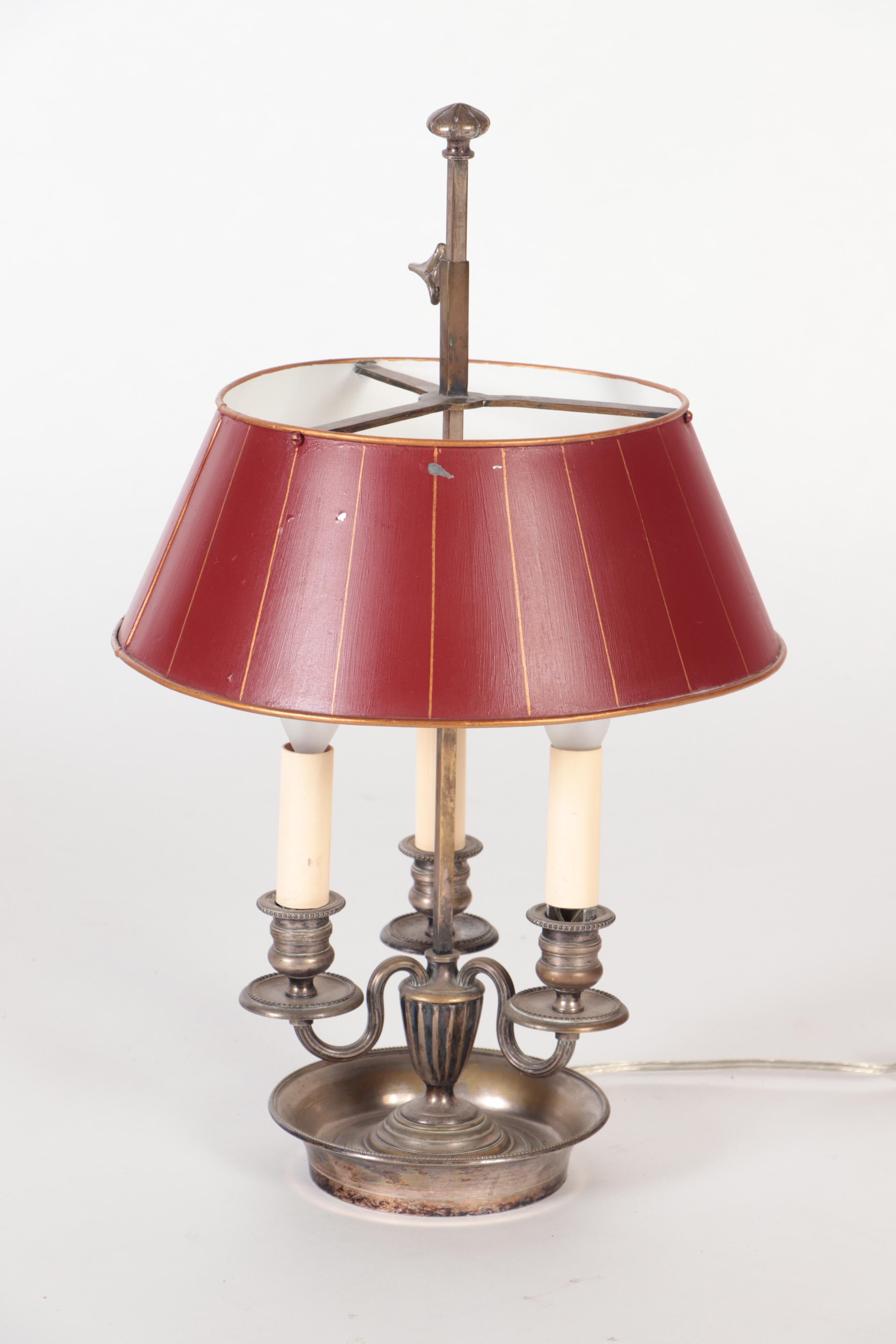 A lovely silver plated bouillotte lamp with tole shade, original patina. 19th C.