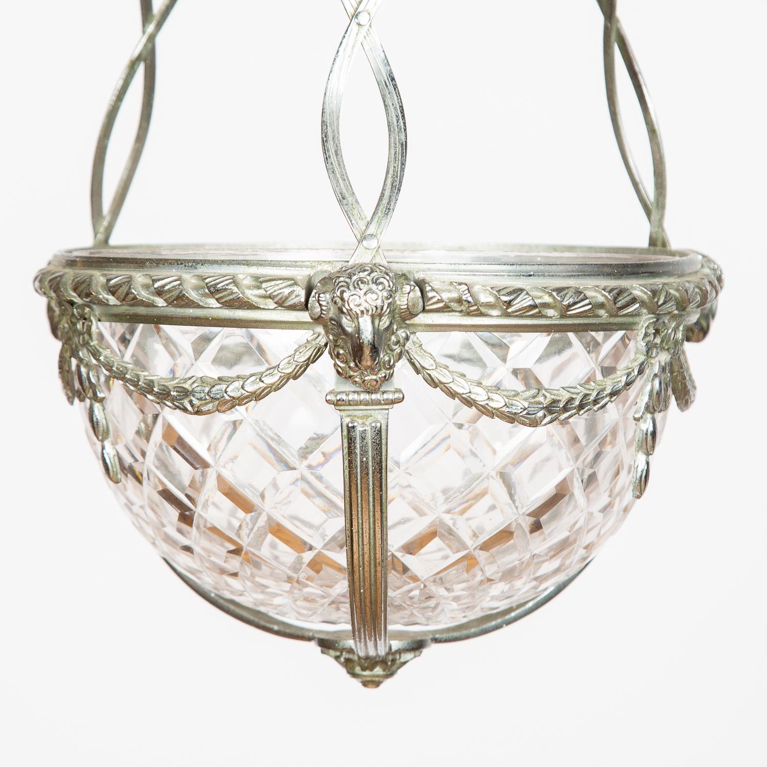A silver plated hanging light with cut glass bowl, circa 1875.

Silvered metalwork decorated with ram's heads and swags.

Marked: F & S 


Faraday & Son of Berners Street, London. Established in 1817 by Robert Faraday. (The brother of Michael