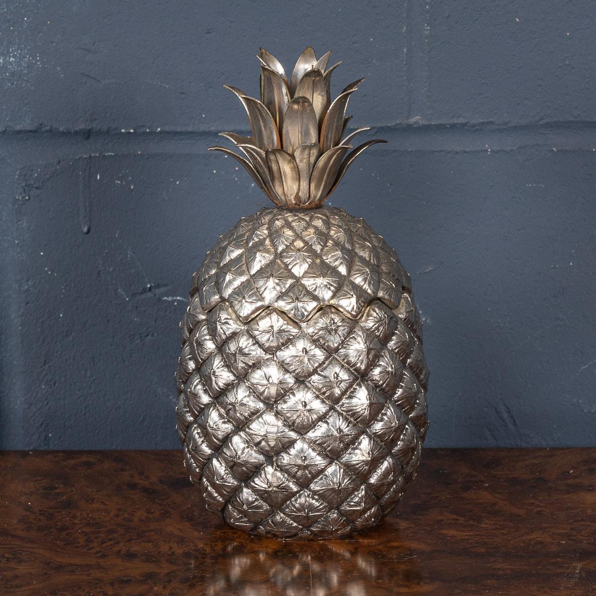 A beautiful ice bucket by Mauro Manetti, made in Italy around the 1970s. Fashioned as a pineapple, this silvered pewter ice bucket was designed by Mauro Manetti for the Fonderia D’Arte foundry in Florence, Italy. Stamped to the