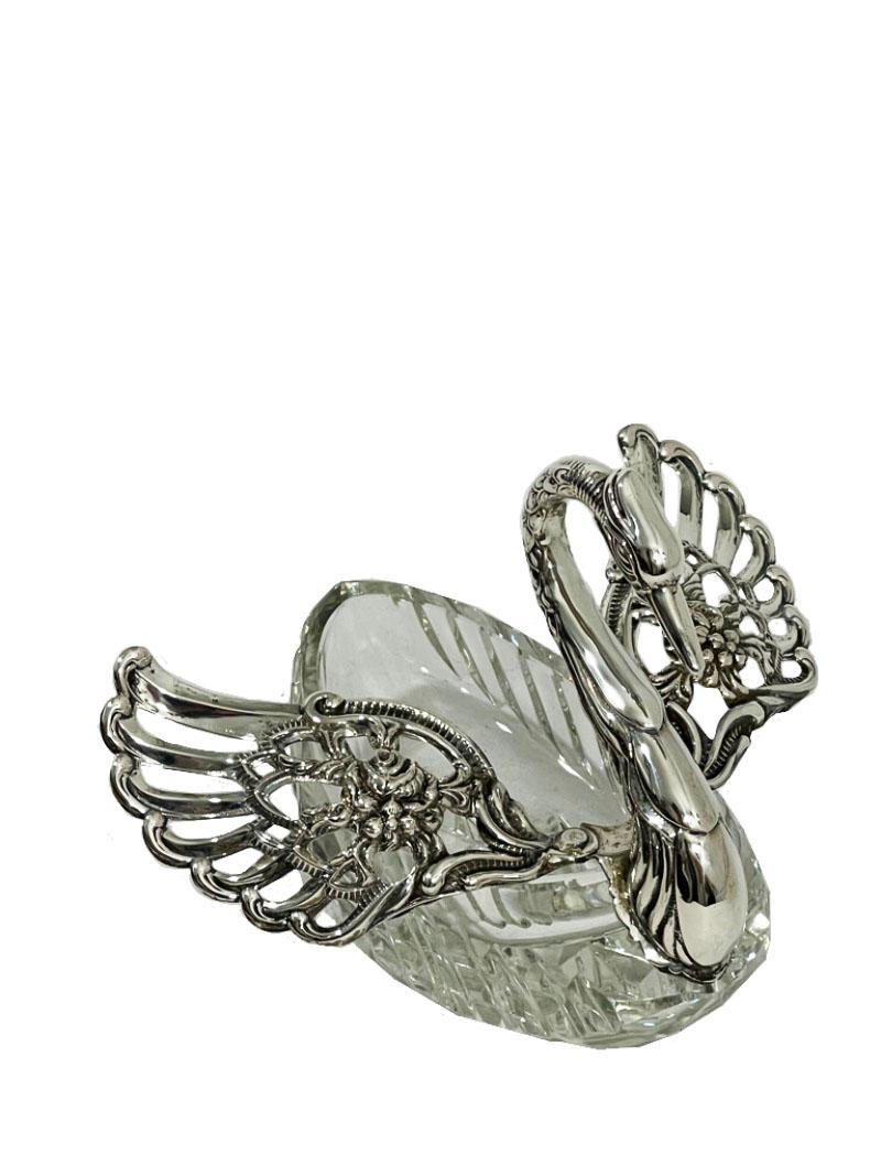 A silver with crystal swan basket by Albert Bodemer, Germany

A crystal bonbon basket in the shape of a swan, made partly in silver, by Albert Bodemer, Germany.
Re-marked by the Dutch silversmith Jan van Hout Ververgaard, Nijmegen