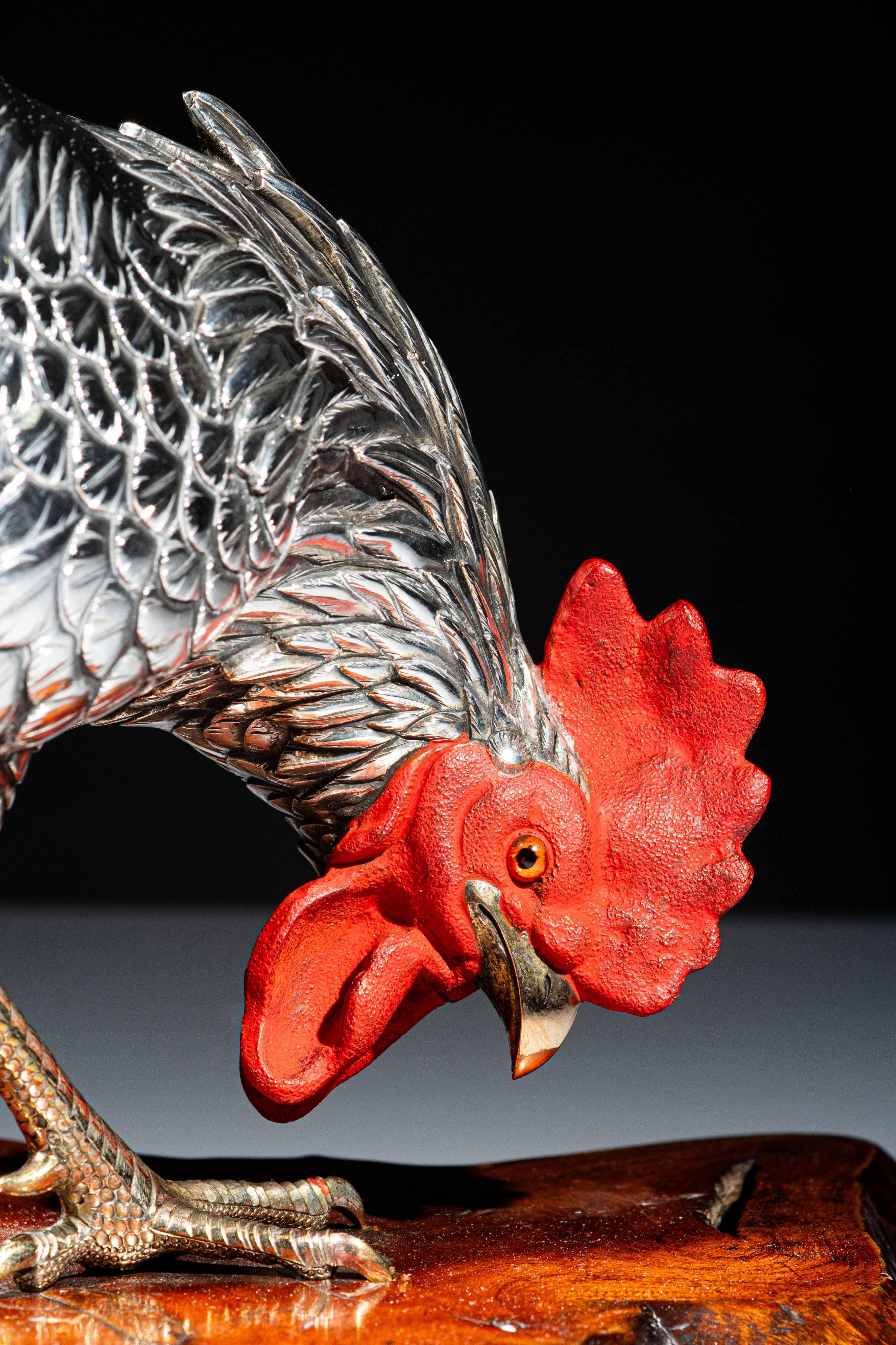 A silvered bronze study of a rooster with golden legs and beak, a red enamel crest, and glass eyes on a root base signed Yoshiaki zō (Made by Yoshiaki).
Work published in the volume “Selezione 2023“.

Height: 38 cm
Meiji, c. 1890