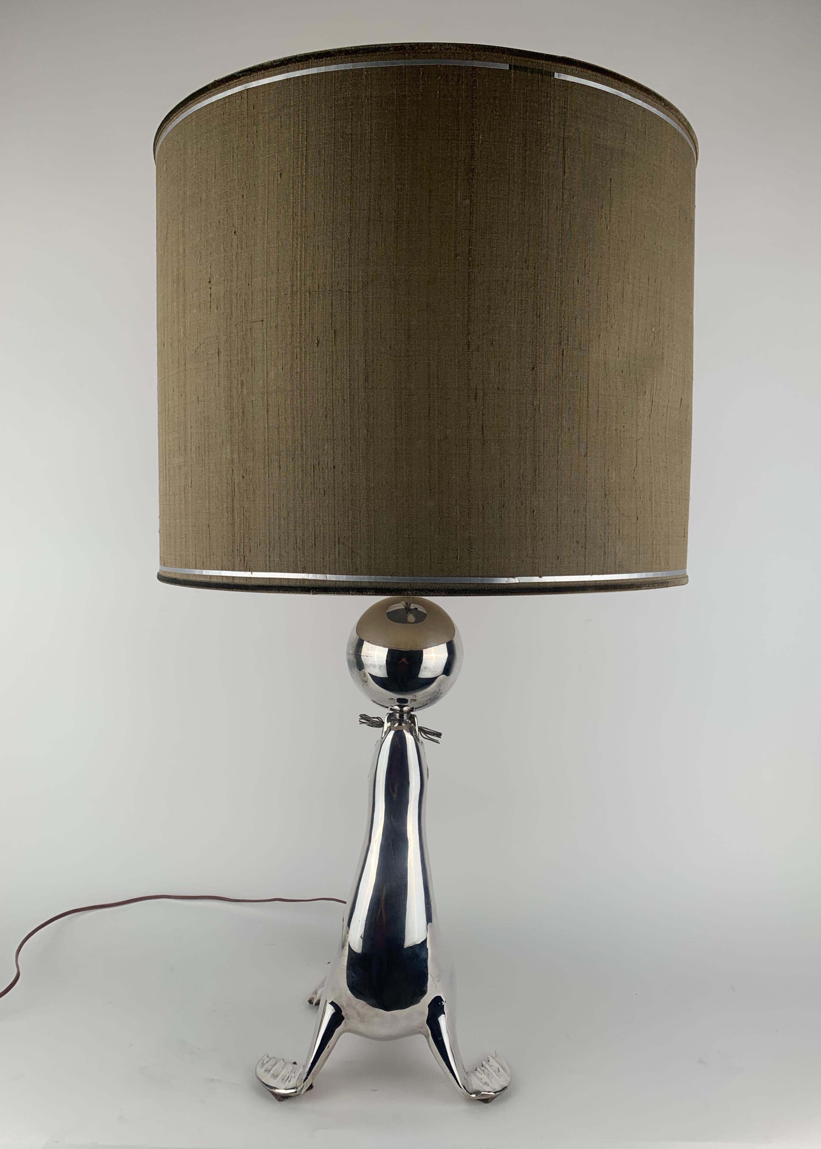 French A silvered seal as a table lamp For Sale