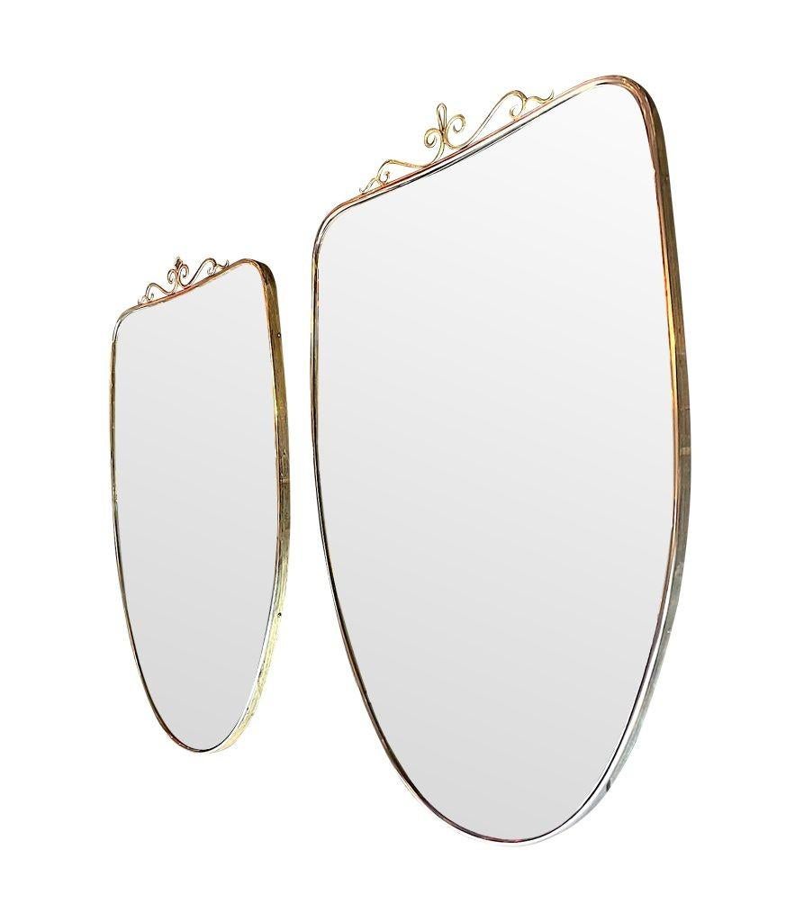 20th Century Similar Pair of Original 1960s Italian Shield Mirrors with Scroll Top Detail