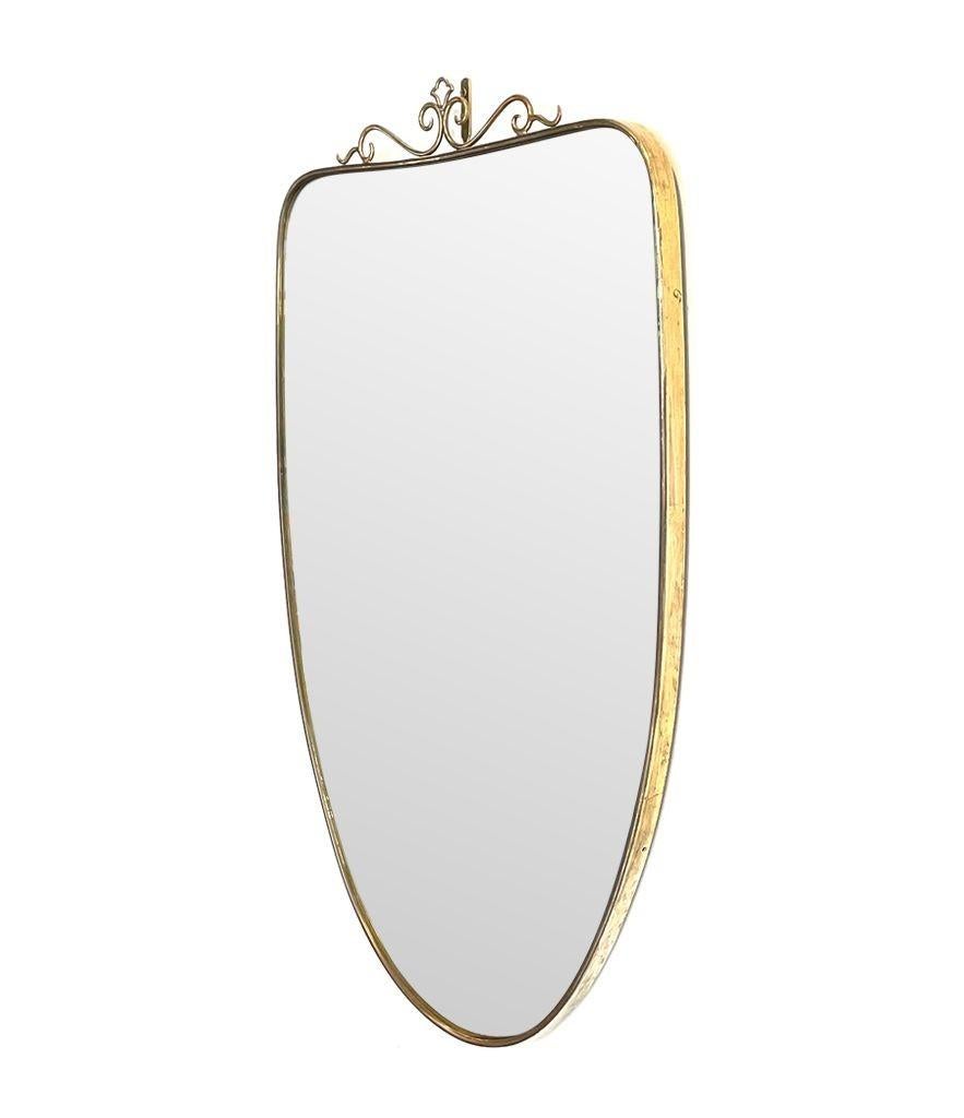 Brass Similar Pair of Original 1960s Italian Shield Mirrors with Scroll Top Detail