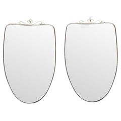 Similar Pair of Original 1960s Italian Shield Mirrors with Scroll Top Detail