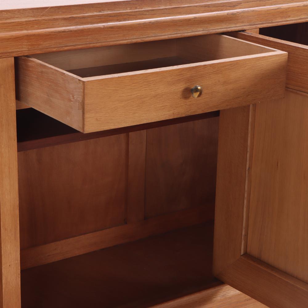 A simple and elegant French oak sideboard, C. 1940. In Good Condition For Sale In Philadelphia, PA