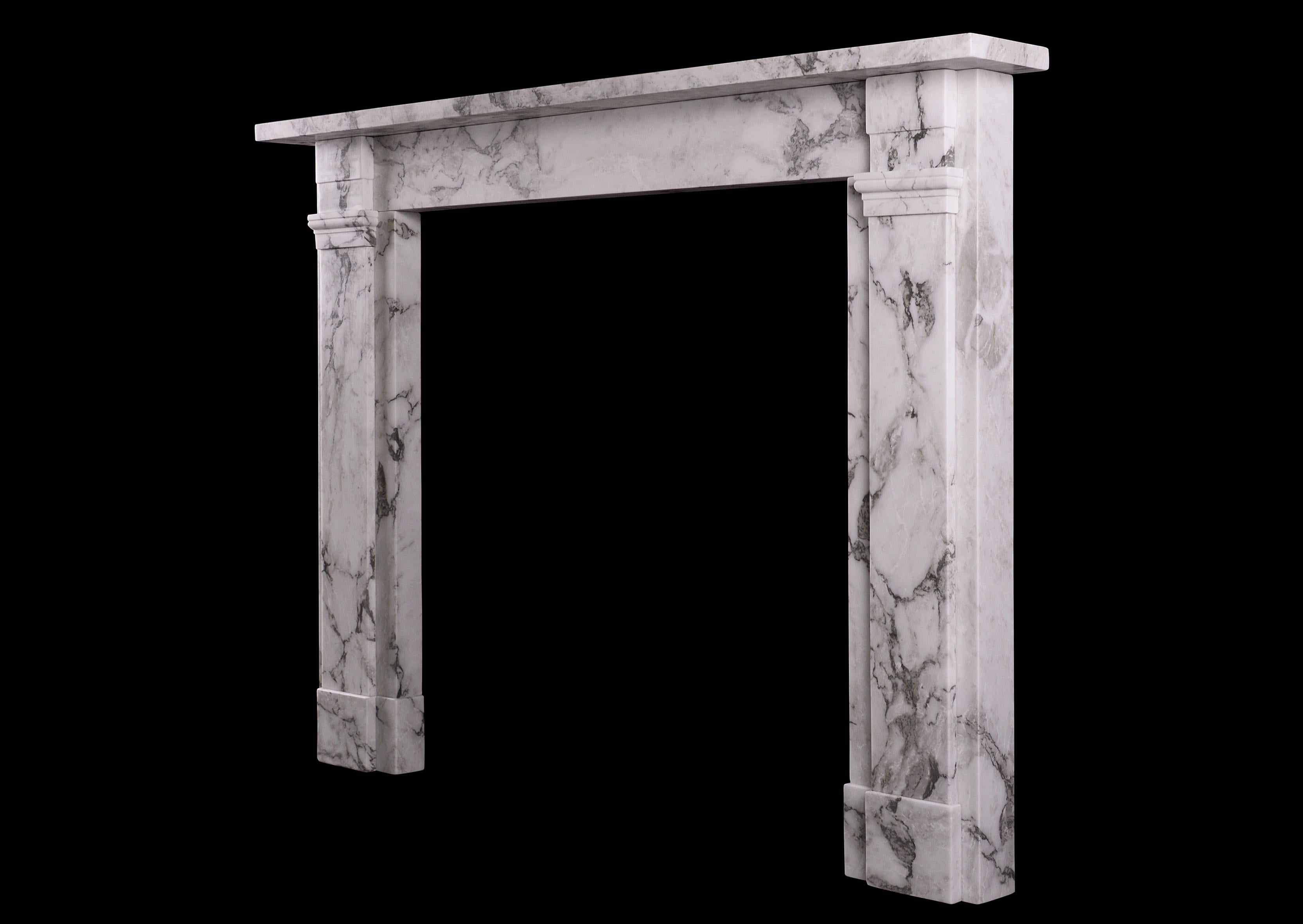 A simple English fireplace in Italian Arabescato marble. The jambs surmounted by moulded capital, with stepped frieze. Plain shelf above. A copy of an original Regency fireplace. N.B. May be subject to an extended lead time, please enquire for more