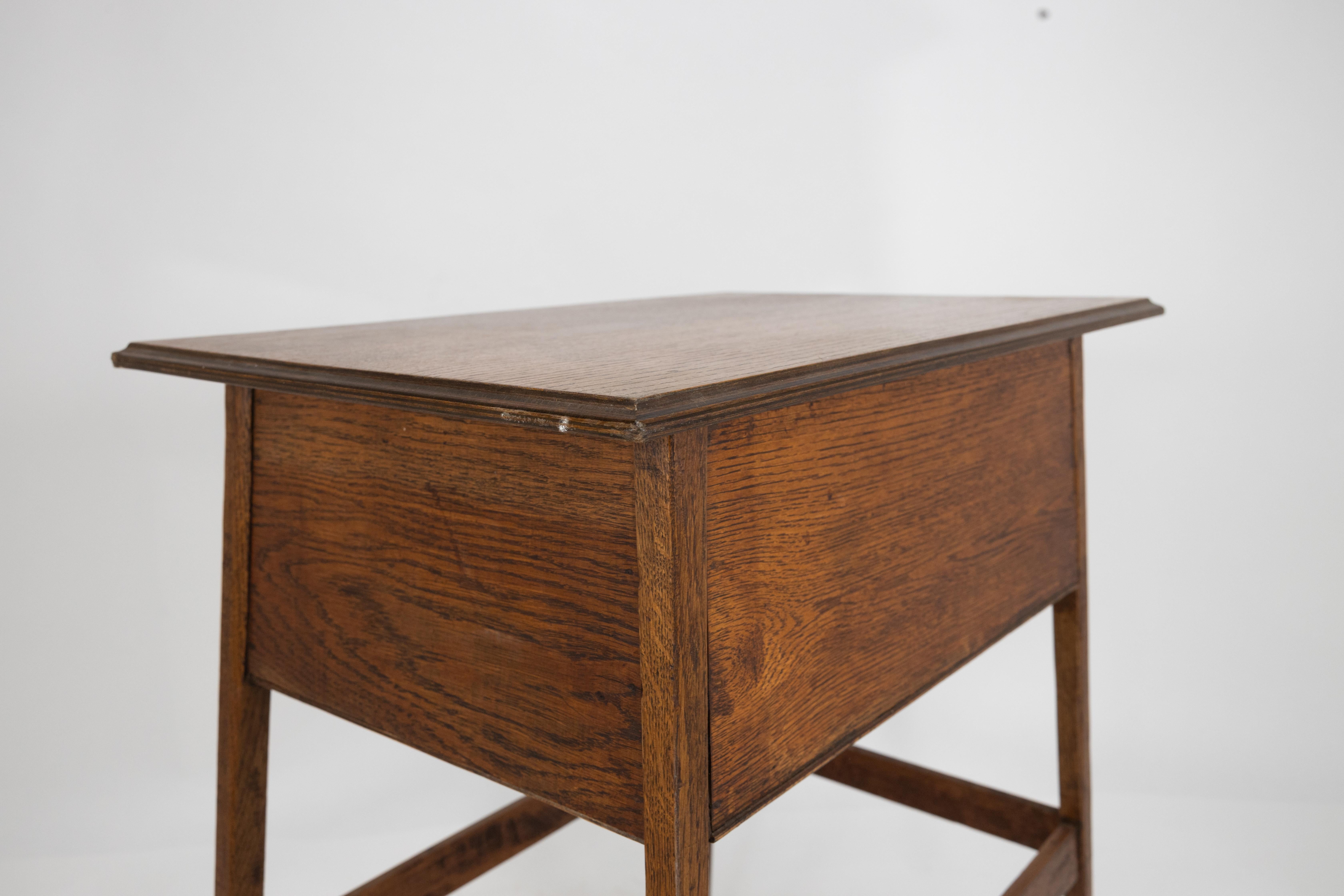 A simple oak oblong side or bedside table with a moulded edge to the top For Sale 4