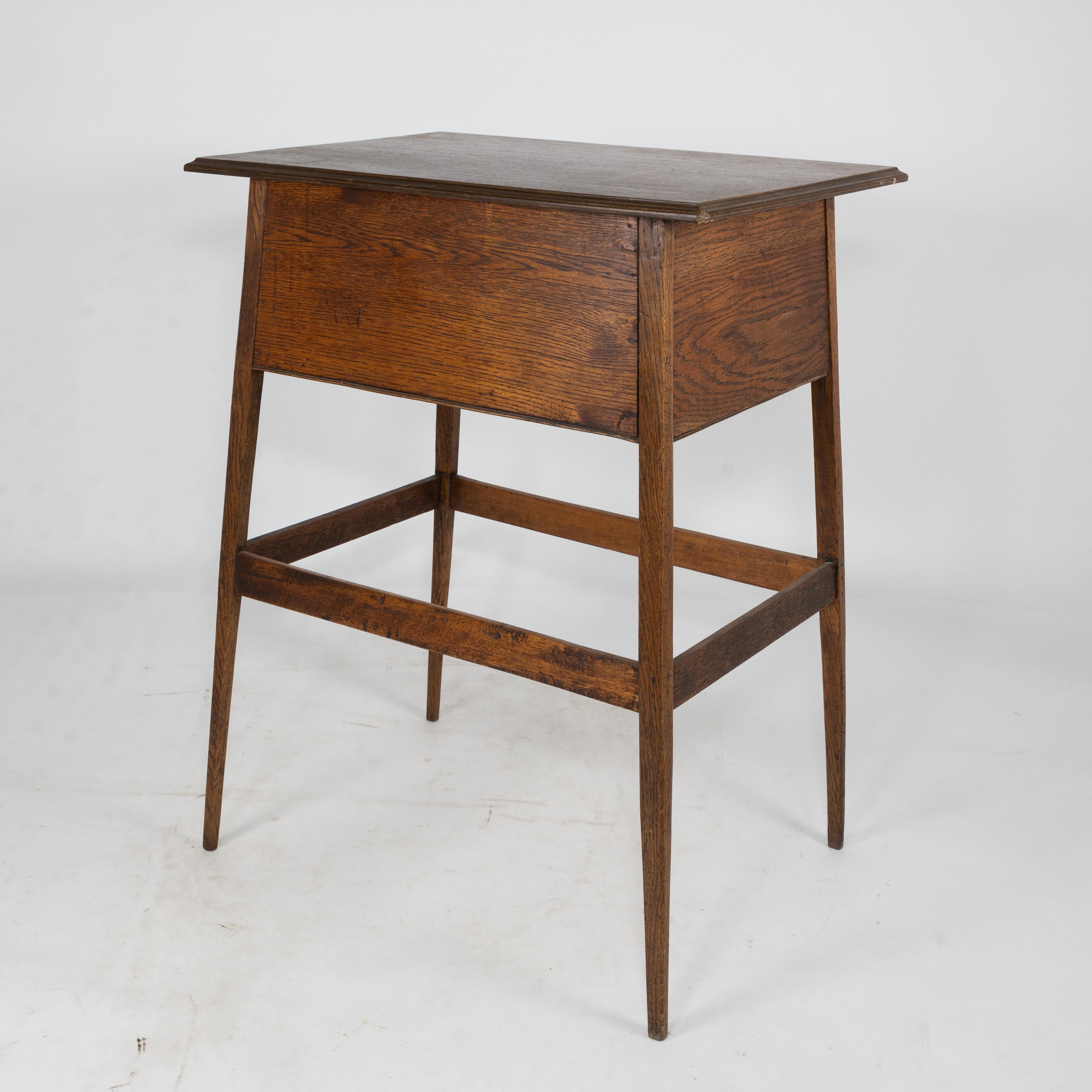 Early 20th Century A simple oak oblong side or bedside table with a moulded edge to the top For Sale