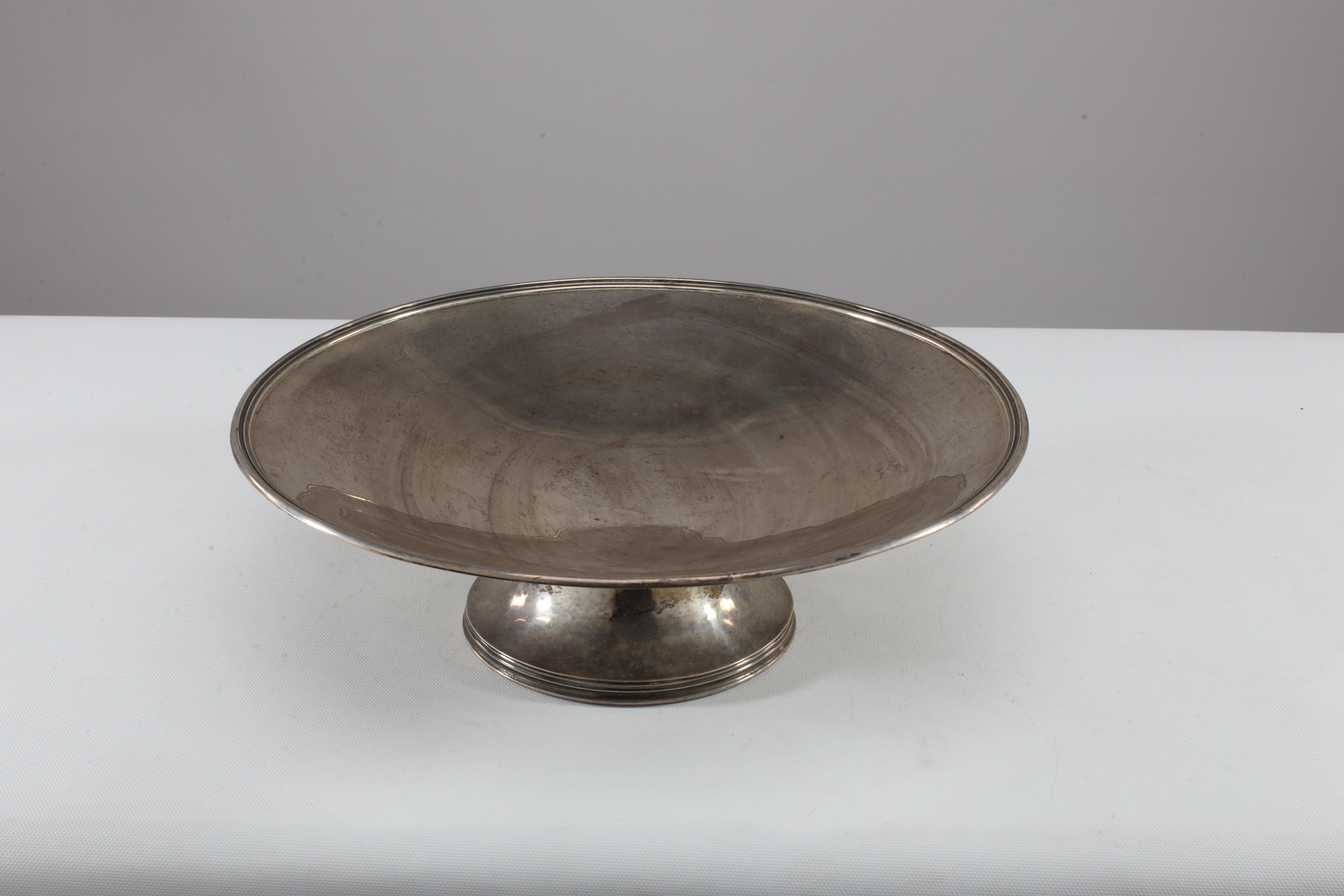 Simple solid silver centre piece made by Dorothy E Vick. Assay marks D.E.V. Birmingham 1945.