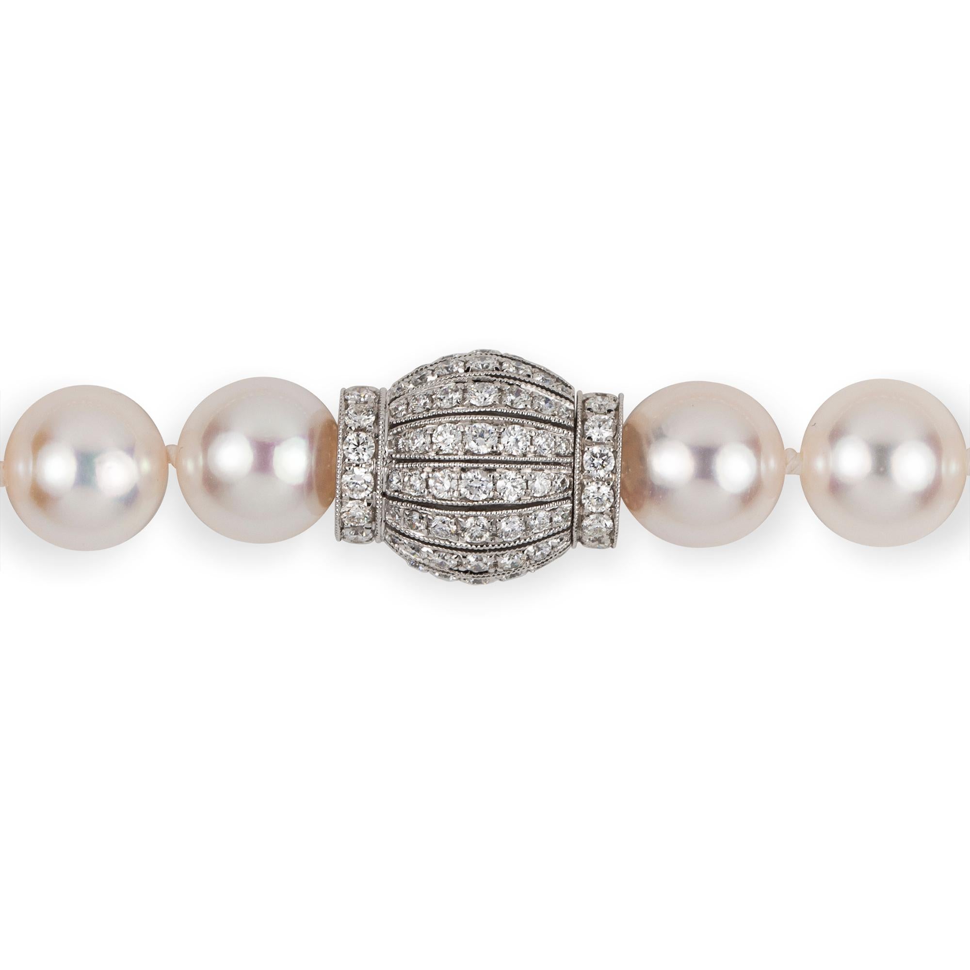 A single Akoya Pearl Necklace With Diamond Clasp, the forty-four fine cultured Akoya pearls measuring approximately 9-9.5mm in diameter, strung and knotted, attached from a diamond-set clasp of barrel-shape design, set with round brilliant-cut