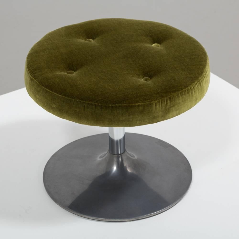 A single circular occasional stool with a polished 'tulip' base, in the manner of Eero Saarinen, 1960s. Upholstered and buttoned in a green velvet by Talisman