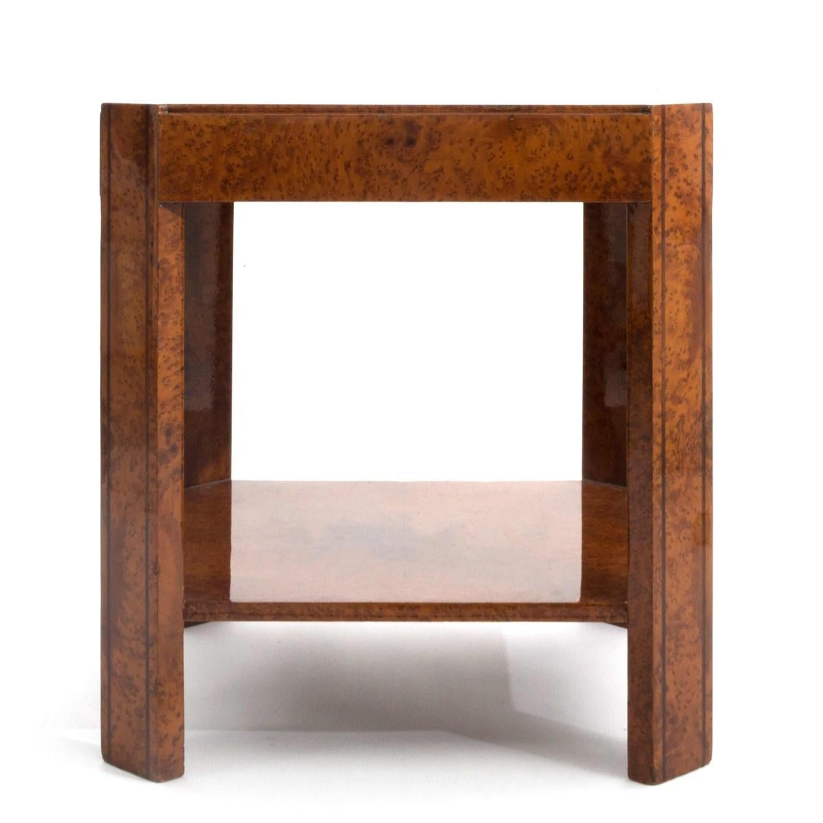 A versatile single Art Deco burl wood side / end table with Macassar banding, French, circa 1940.

Features a square top with cut corners. The 24 inch height makes it ideal for placement next to most sofas.

Dimensions: 22.0 inches L x 22 inches
