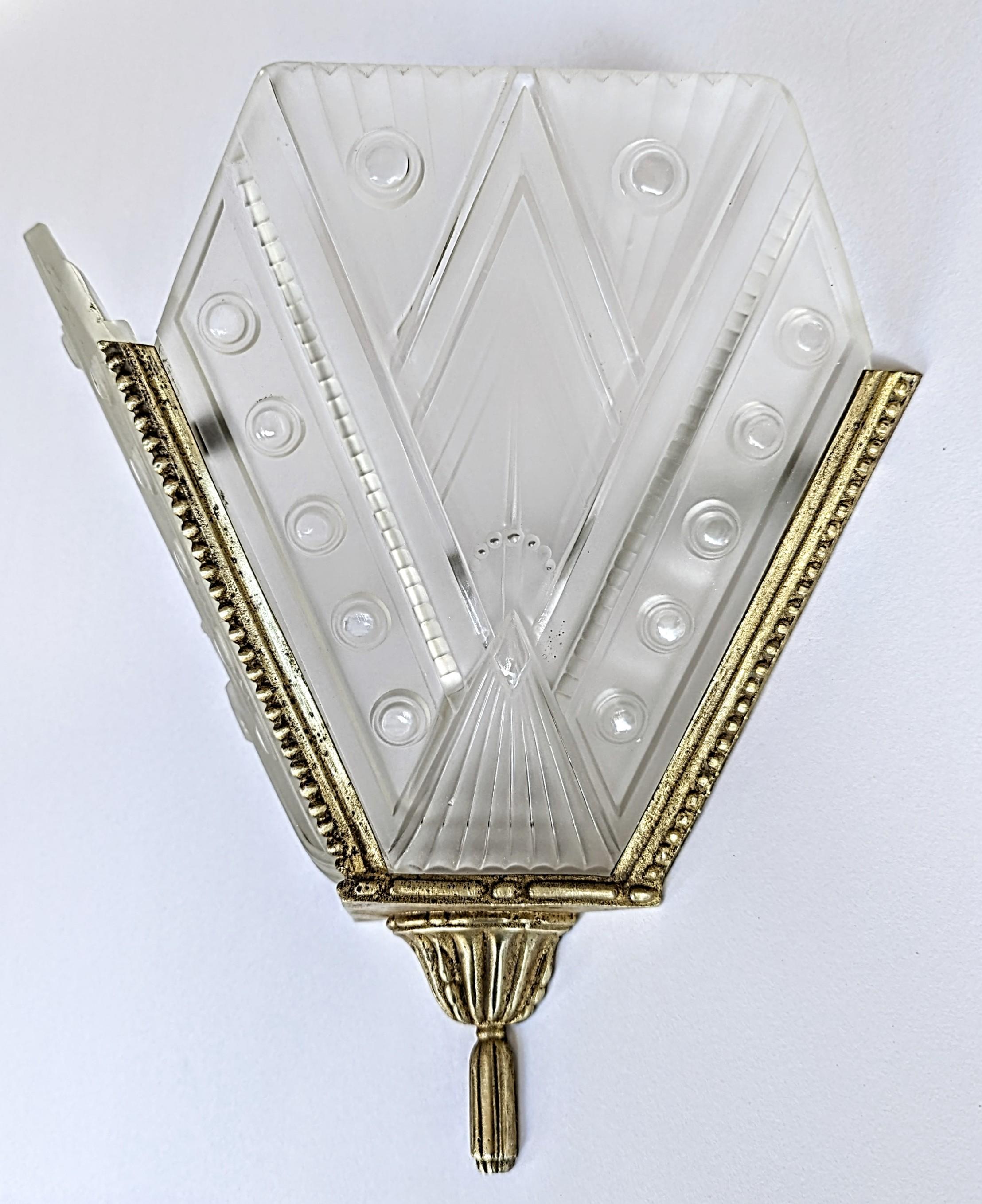 Cast A Pair of French Art Deco Wall Sconces by “Georges Leleu” For Sale