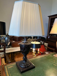 A single Neo-Classical style, carved and stained wood, urn form table lamp