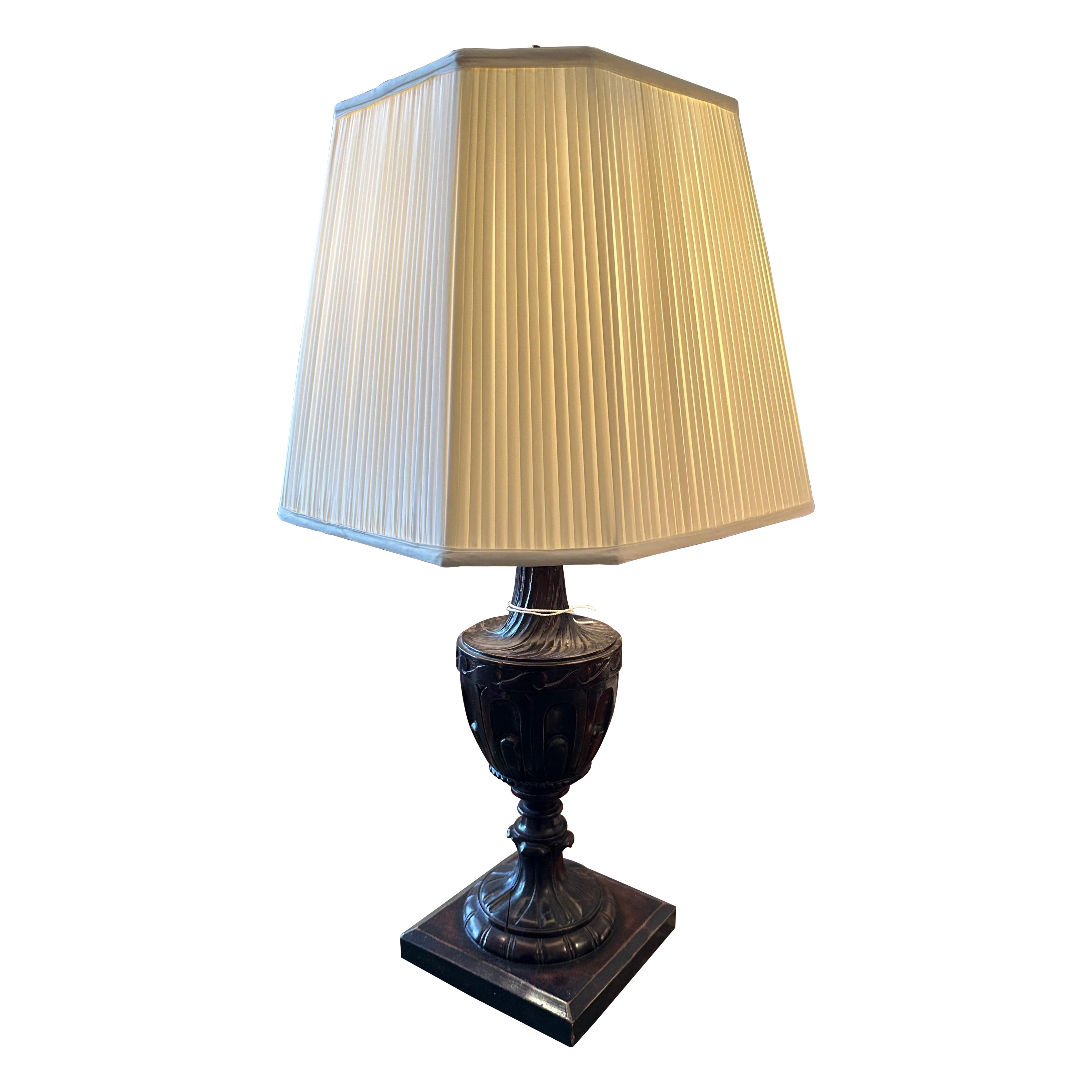 A single Neo-Classical style, carved and stained wood, urn form table lamp in vendita