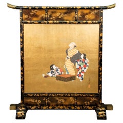 A single-panel screen in lacquered wood, enriched by two paintings