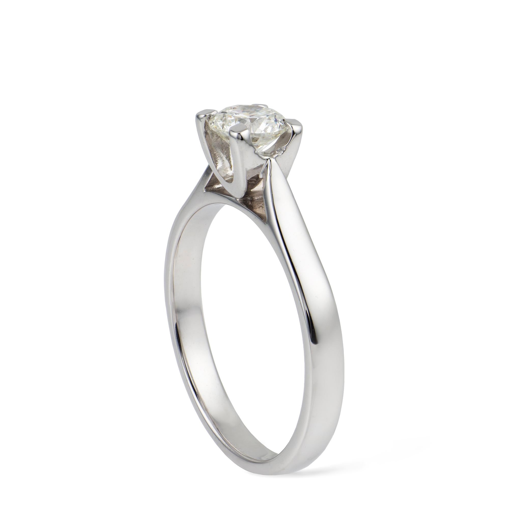 A single stone diamond ring, the round brilliant-cut diamond weighing 0.52 carats, assessed as H colour SI clarity, four claw-set to a U-shaped collet to a flat shank, all mounted in white gold, hallmarked 18ct London bearing the Bentley & Skinner